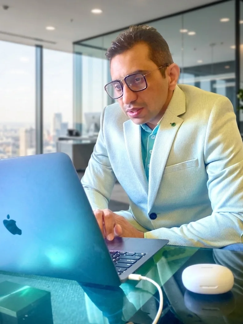 Pradeep Dahiya working on a MacBook